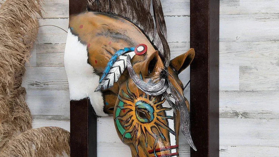 Image of metal horse head with tribal painting