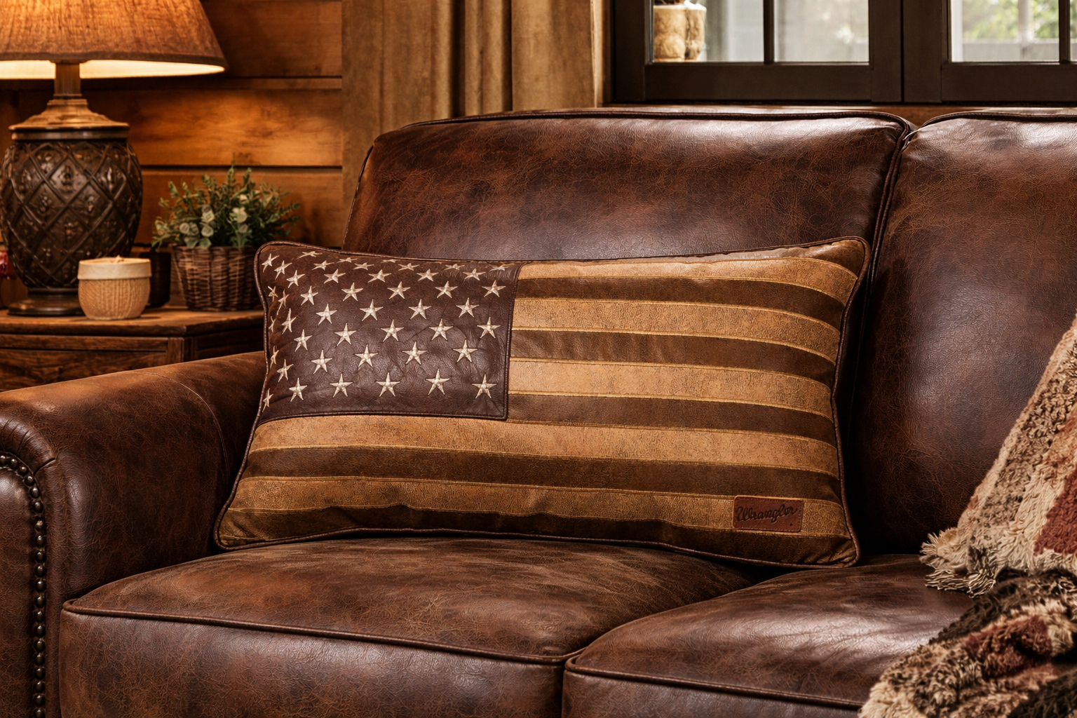 Brown leather sofa with an American flag pillow in a cozy living room setting - Your Western Decor
