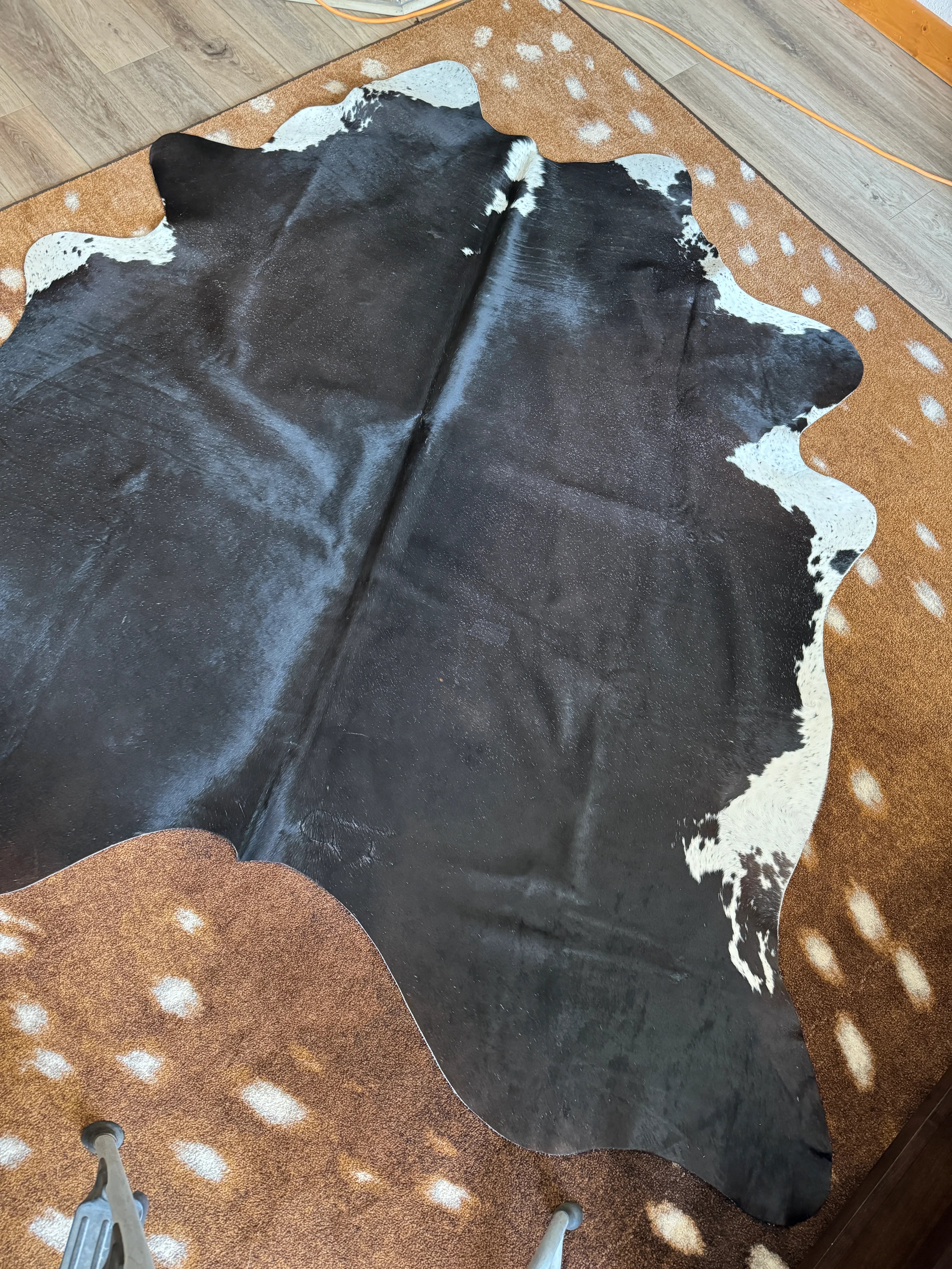 Black Brazilian cowhide with white - Your Western Decor