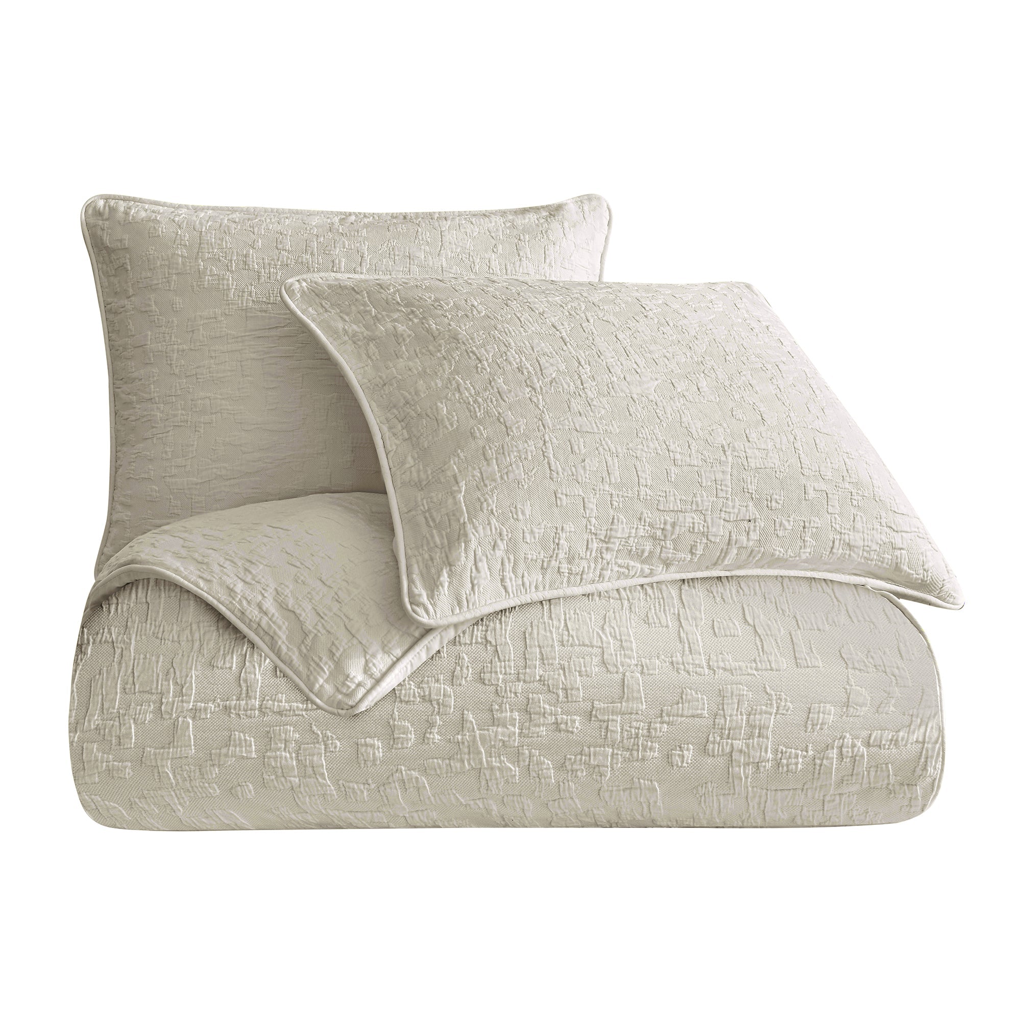 Textured beige quilt and pillow set on a white background