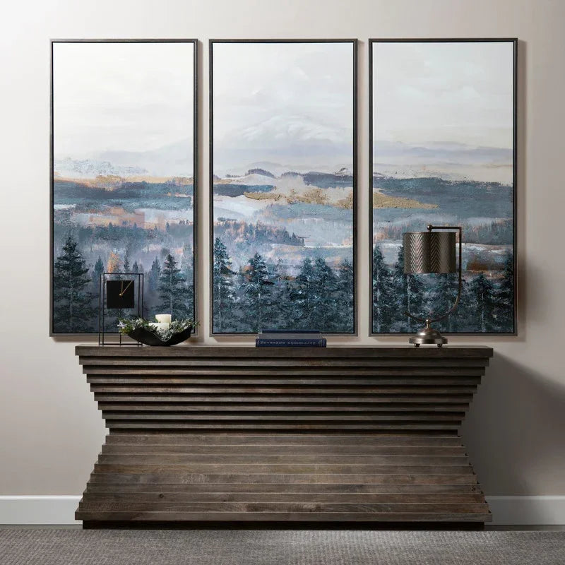 abstract pine forest landscape canvas wall art set in blue and neutral tones for modern rustic and designer interiors above console table