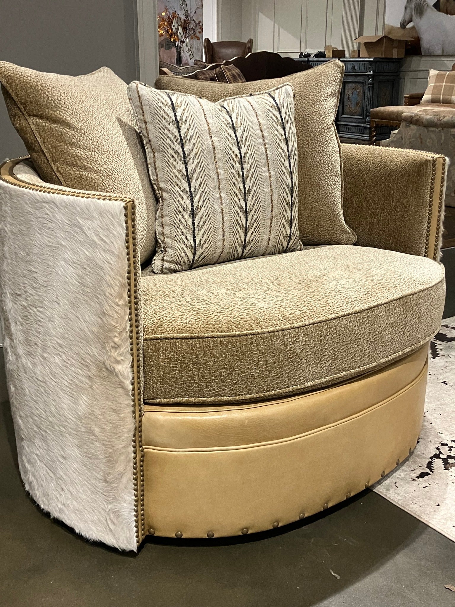 Palomino cowhide, leather, fabric swivel chair