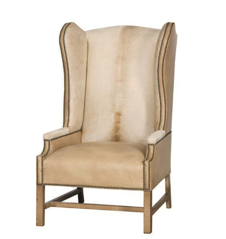 Palomino Cowhide and leather wingback chair with nailhead trim