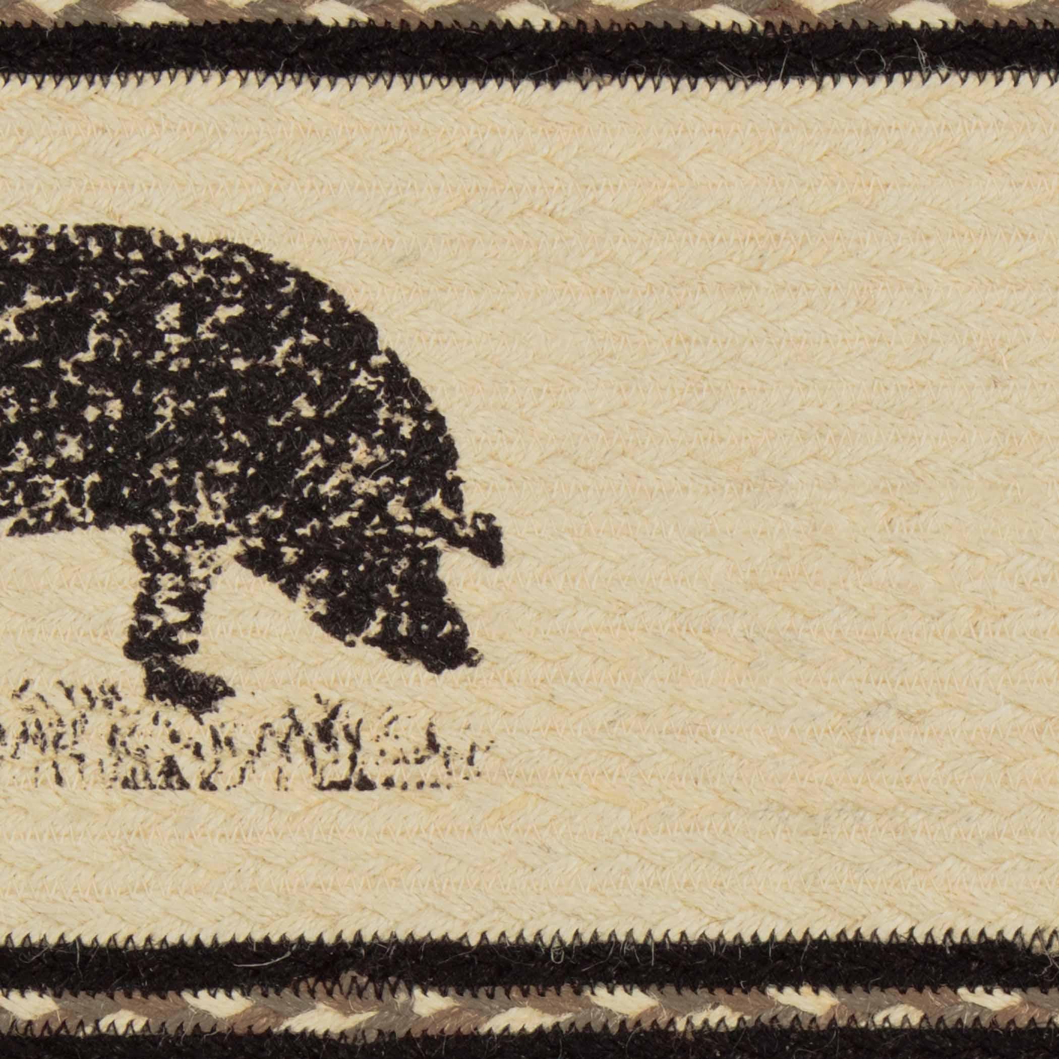Textile jute oval stair tread with a black pig silhouette on a beige background - Your Western Decor