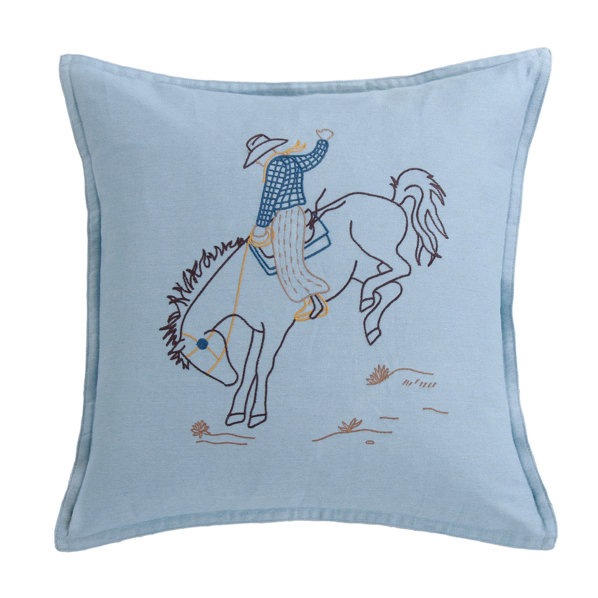 Embroidered pillow with a cowboy riding a horse design on a light blue background