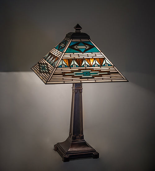 Valencia Turquoise Mission table lamp with stained glass lamp shade and bronze lamp pedestal on a gray background