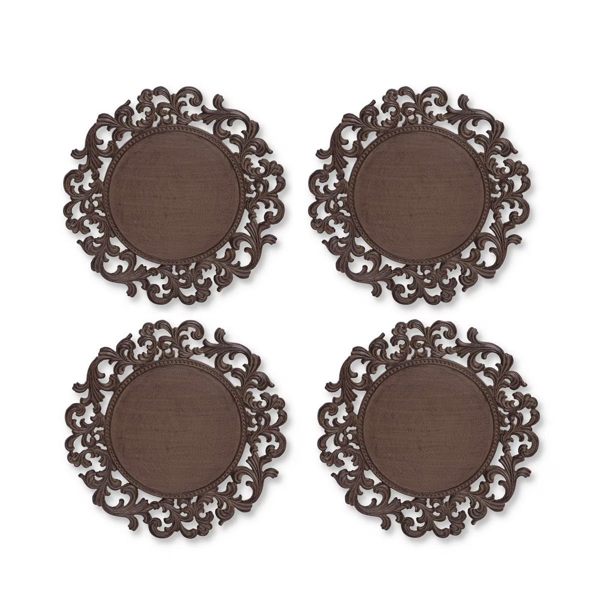 Four round dark brown decorative charger plates with ornate carved scrollwork borders, arranged in a two-by-two grid on a white background.