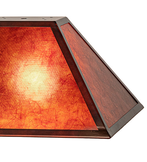 Rectangle amber mica lamp shade with iron frame detail. Light is on