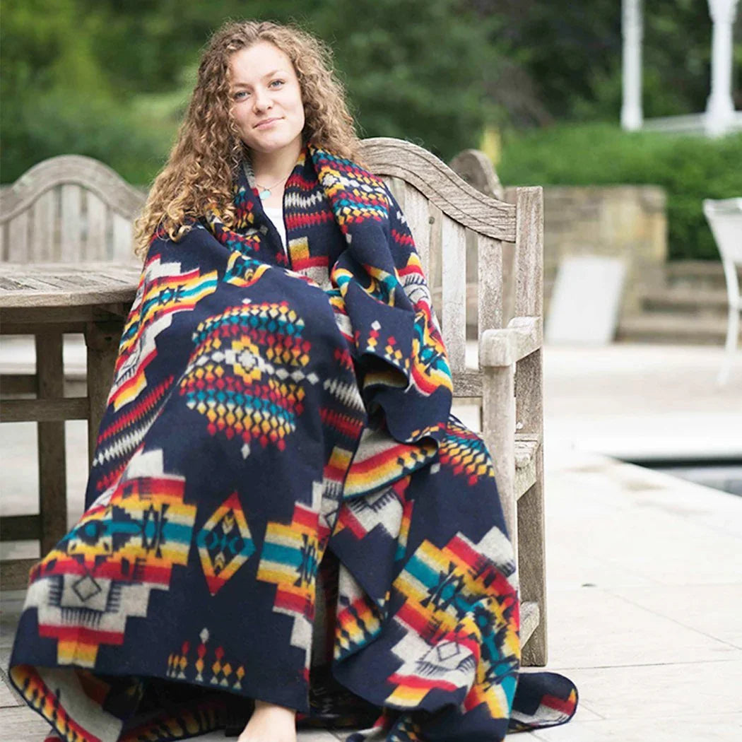Lady using Andes Midnight Queen size Southwestern blanket - Your Western Decor