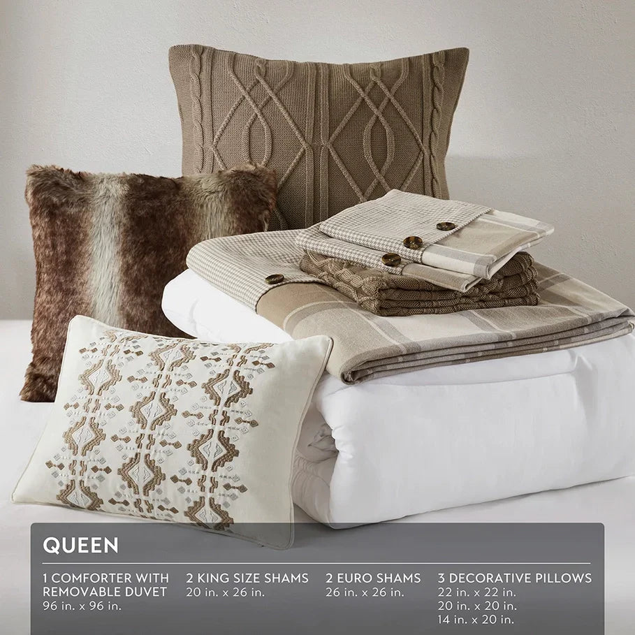 Bedding set with shams, duvet, and decorative pillows on a bed - Your Western Decor