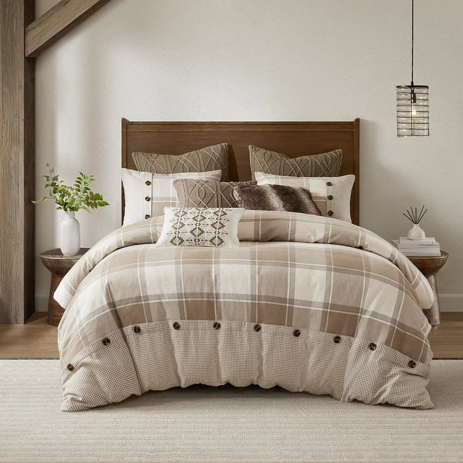 Plaid comforter set on a bed with decorative pillows in a bedroom setting - Your Western Decor