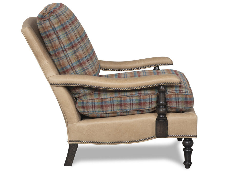 Luxury lodge reading chair with leather arms and plaid upholstery