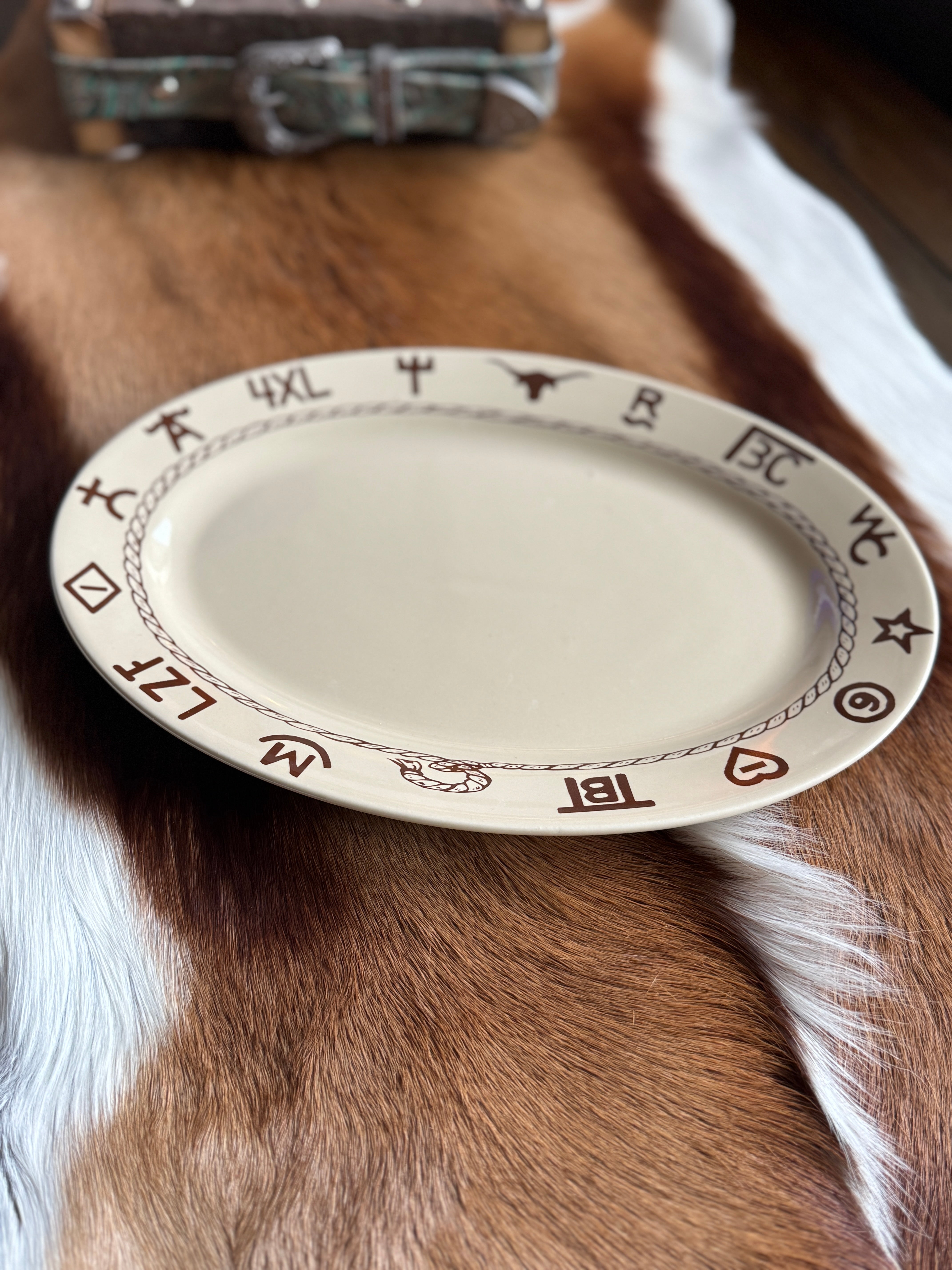 Oval western ceramic steak plate in beige with ranch brands in dark brown