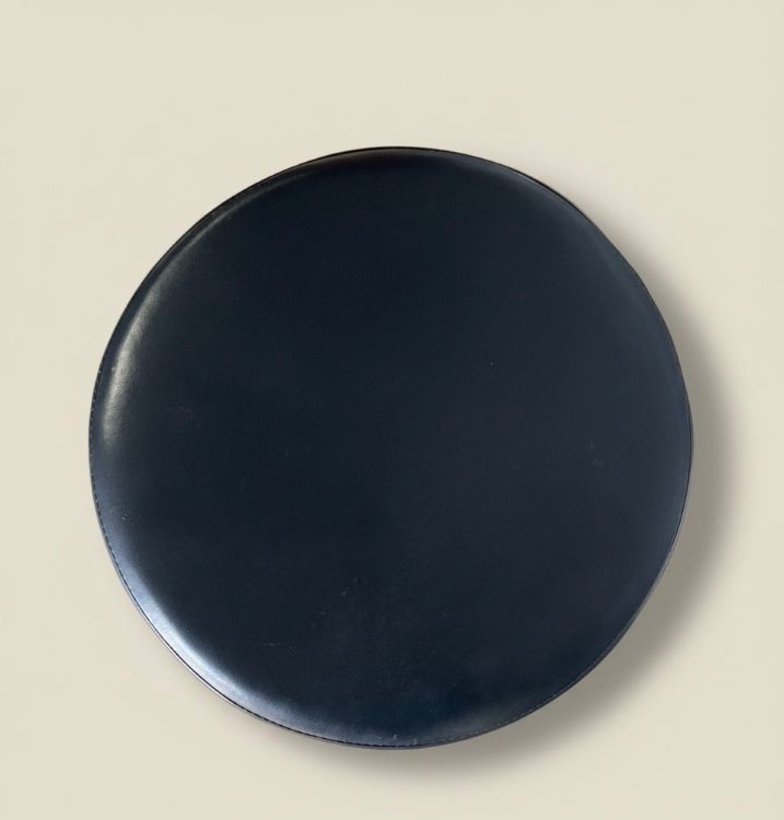 Example of black leather seat on whiskey barrel bar stools