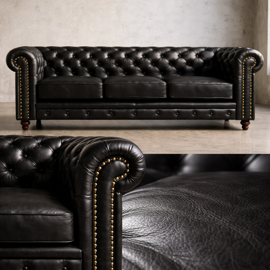 A black leather Chesterfield sofa with deep button tufting, rolled arms, brass nailhead trim, and dark wooden legs, shown in a studio setting with a close-up inset of the arm and leather texture.