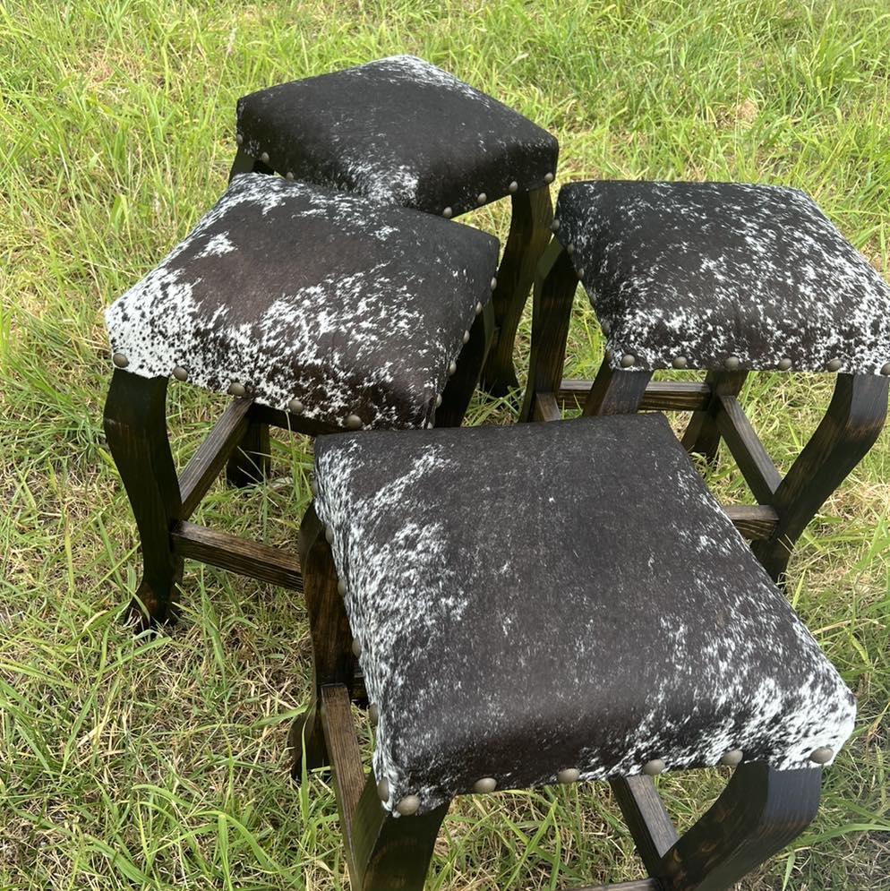 rustic ranch bar stools with nail trim and peppered cowhide seats