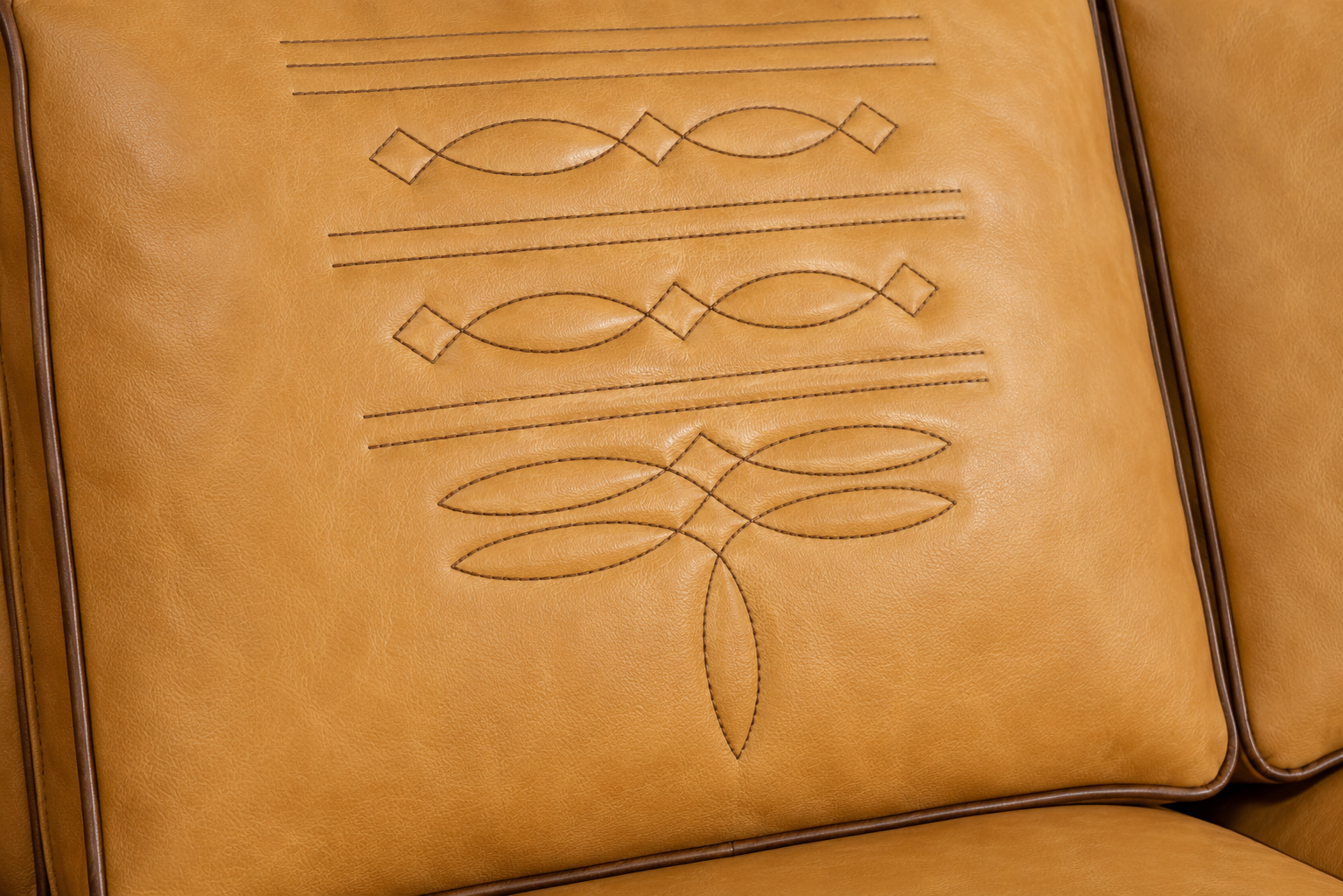 Detail of bott stitching and welt on sofa seat back cushion