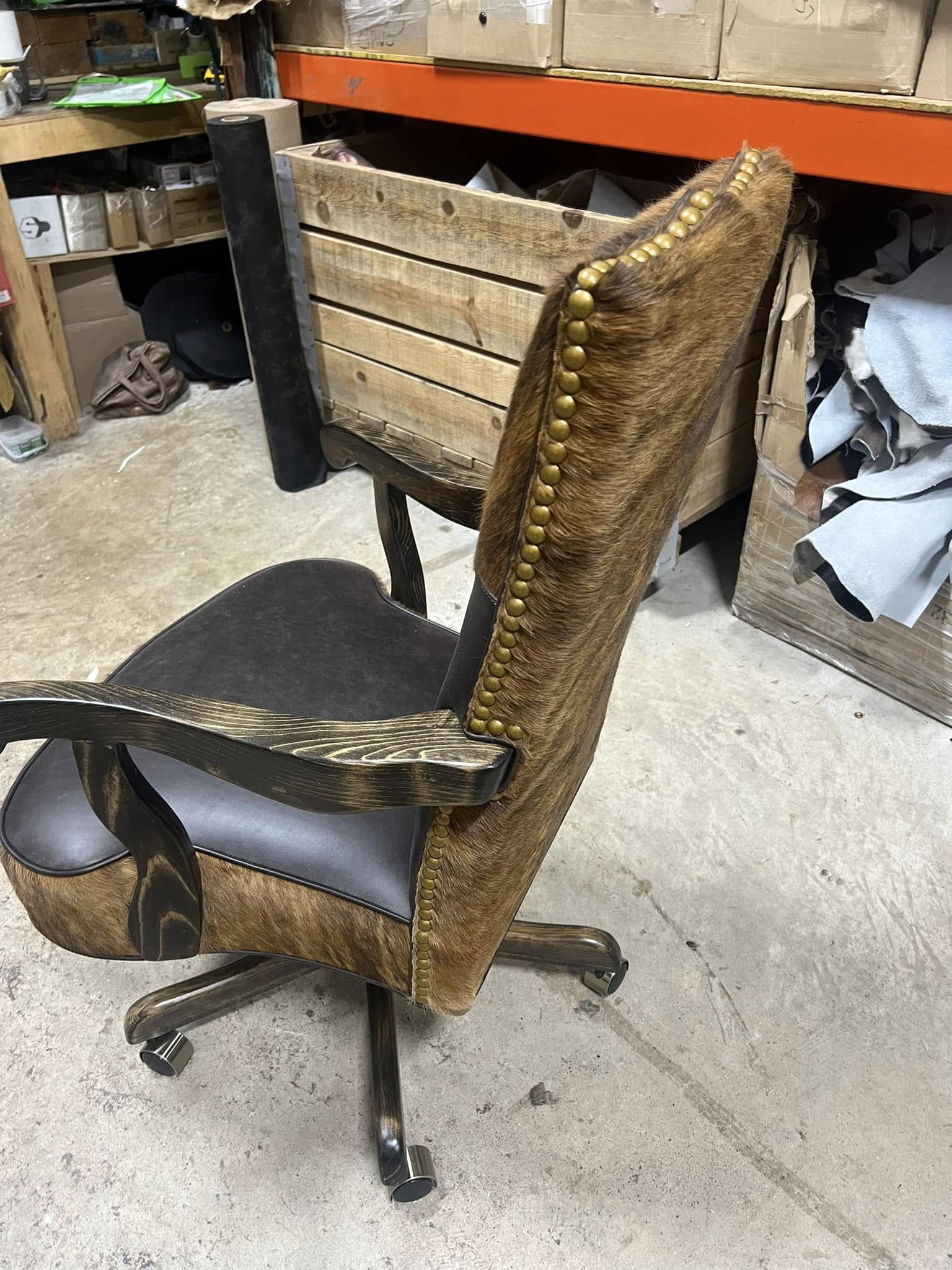 Custom made office chair in dark chocolate leather, brindle cowhide, and nail trim