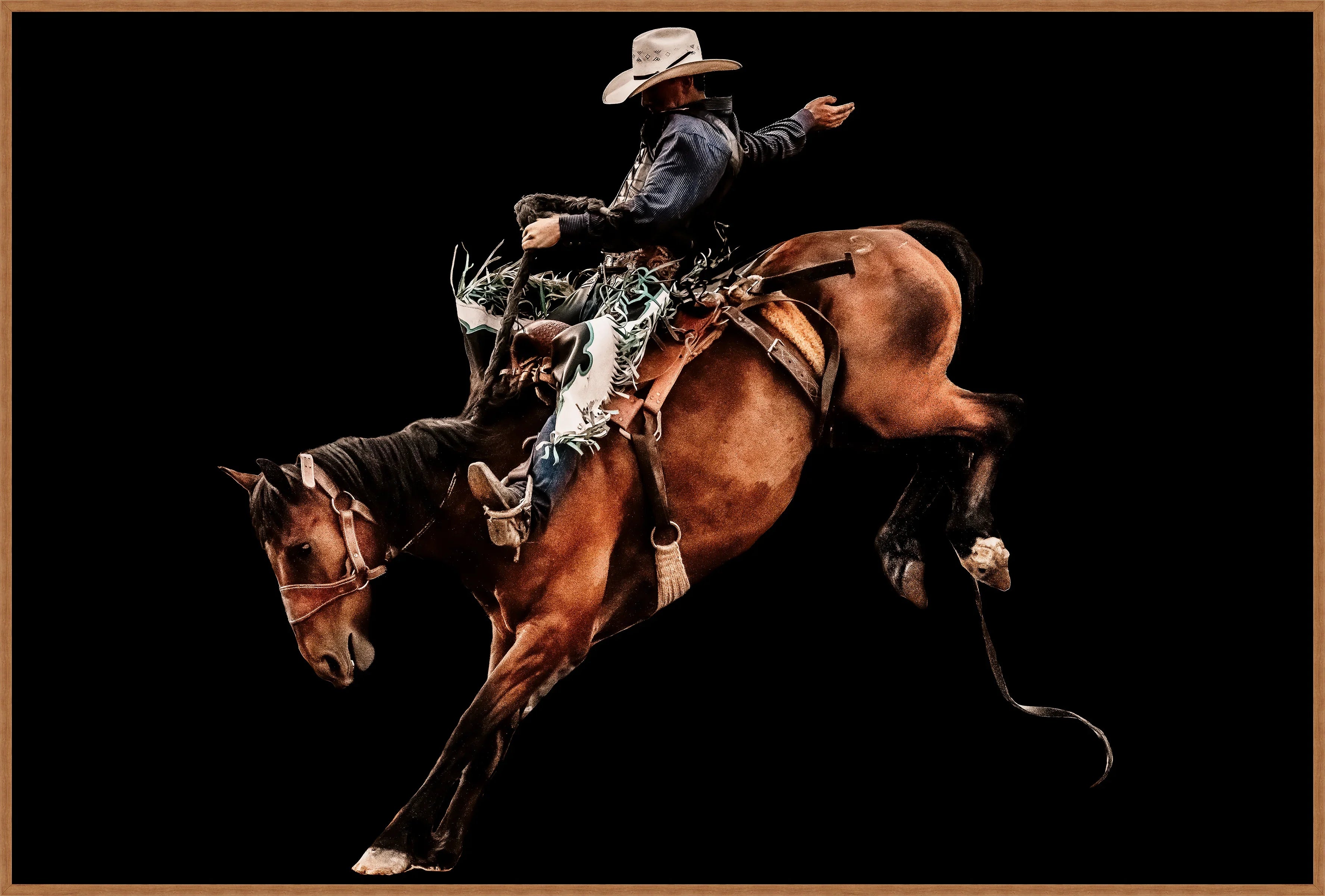 Cowboy riding a bucking horse against a black background canvas art - Your Western Decor