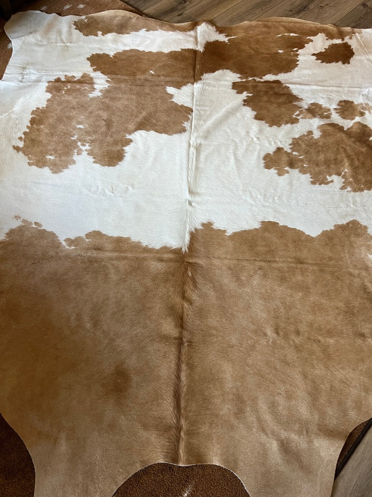 Brown and white Brazilian cowhide rug