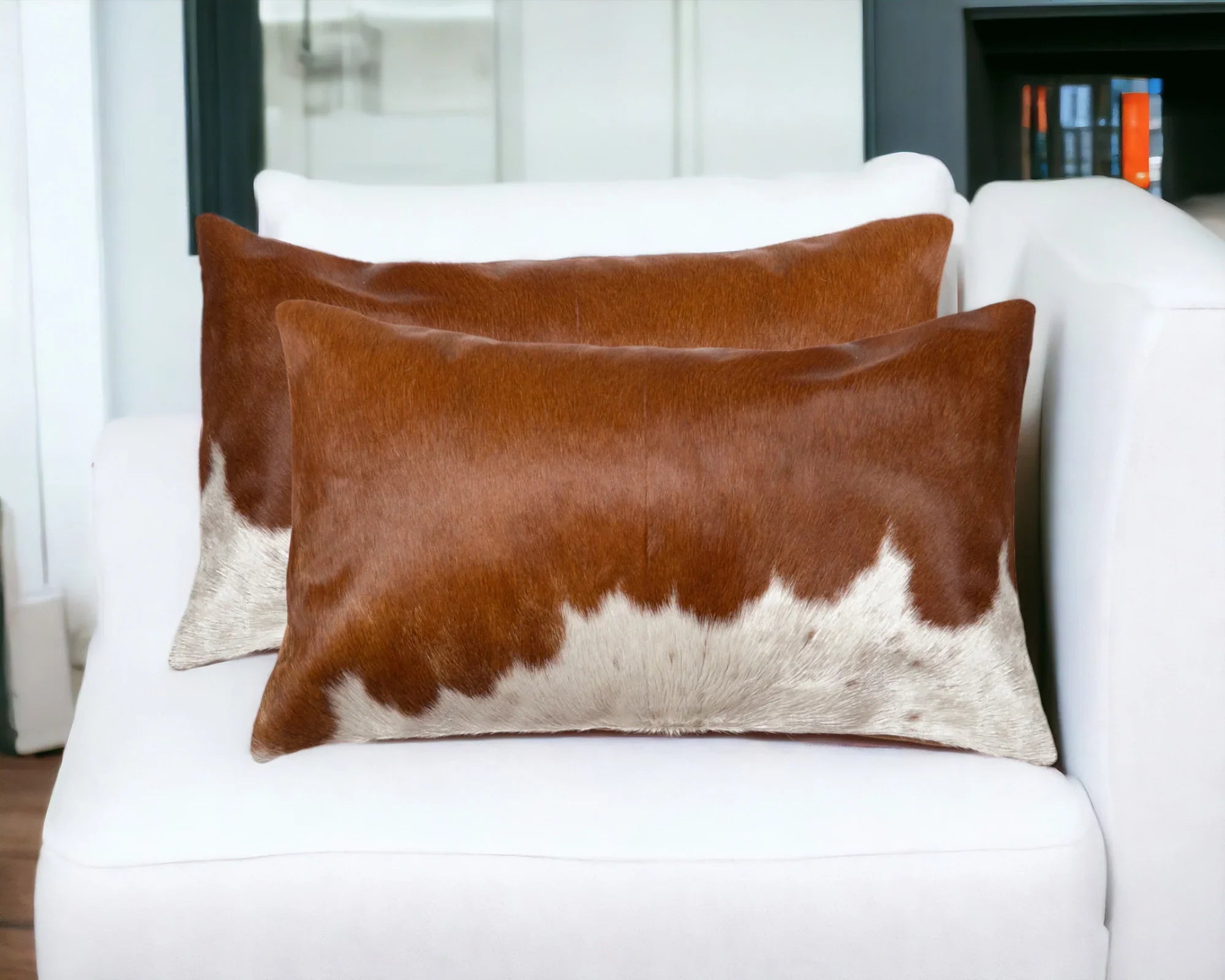 Brown and white oblong cowhide pillow pair