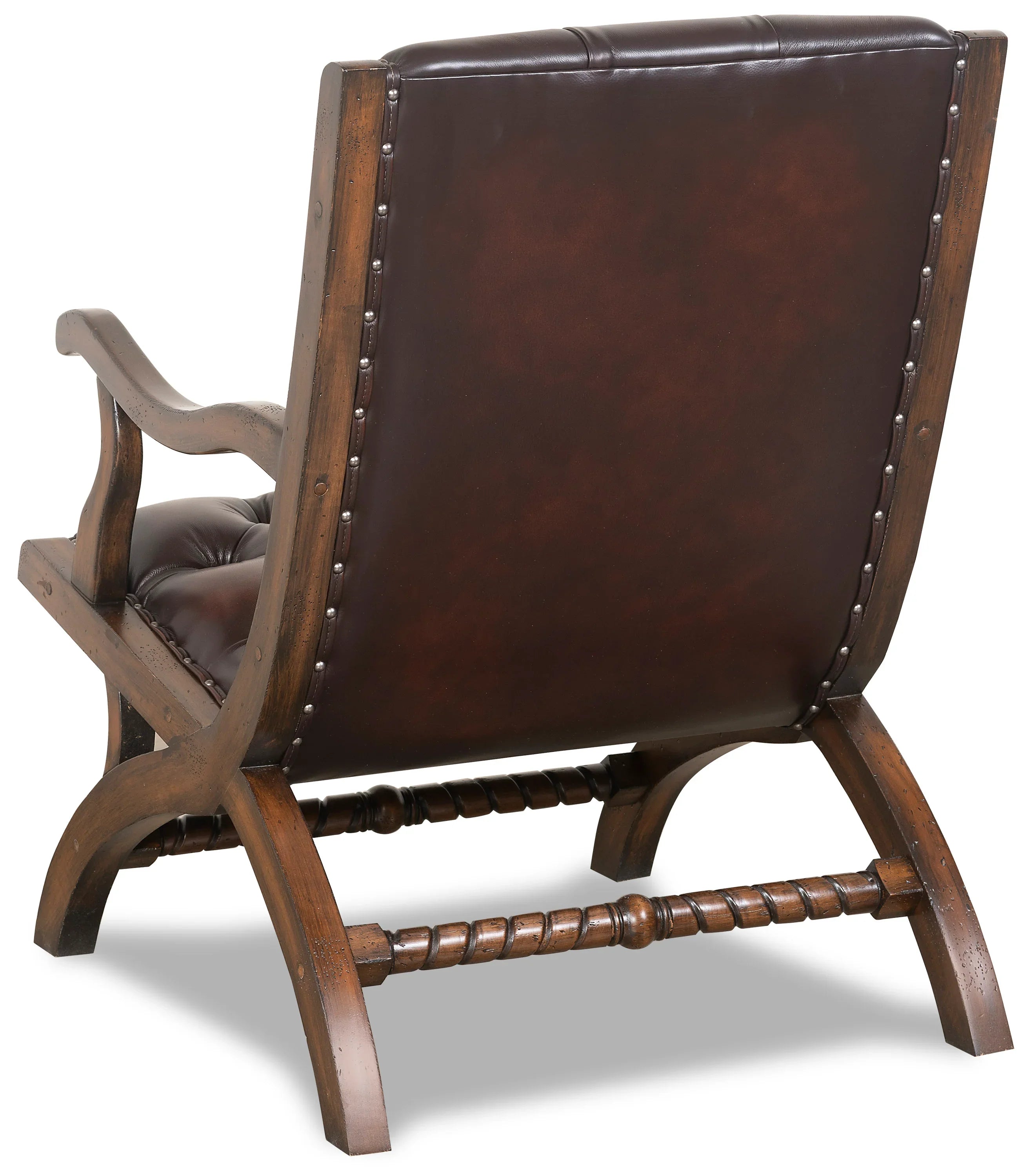 burnished leather tufted reading chair back view with nailhead trim and wood frame in western ranch office setting