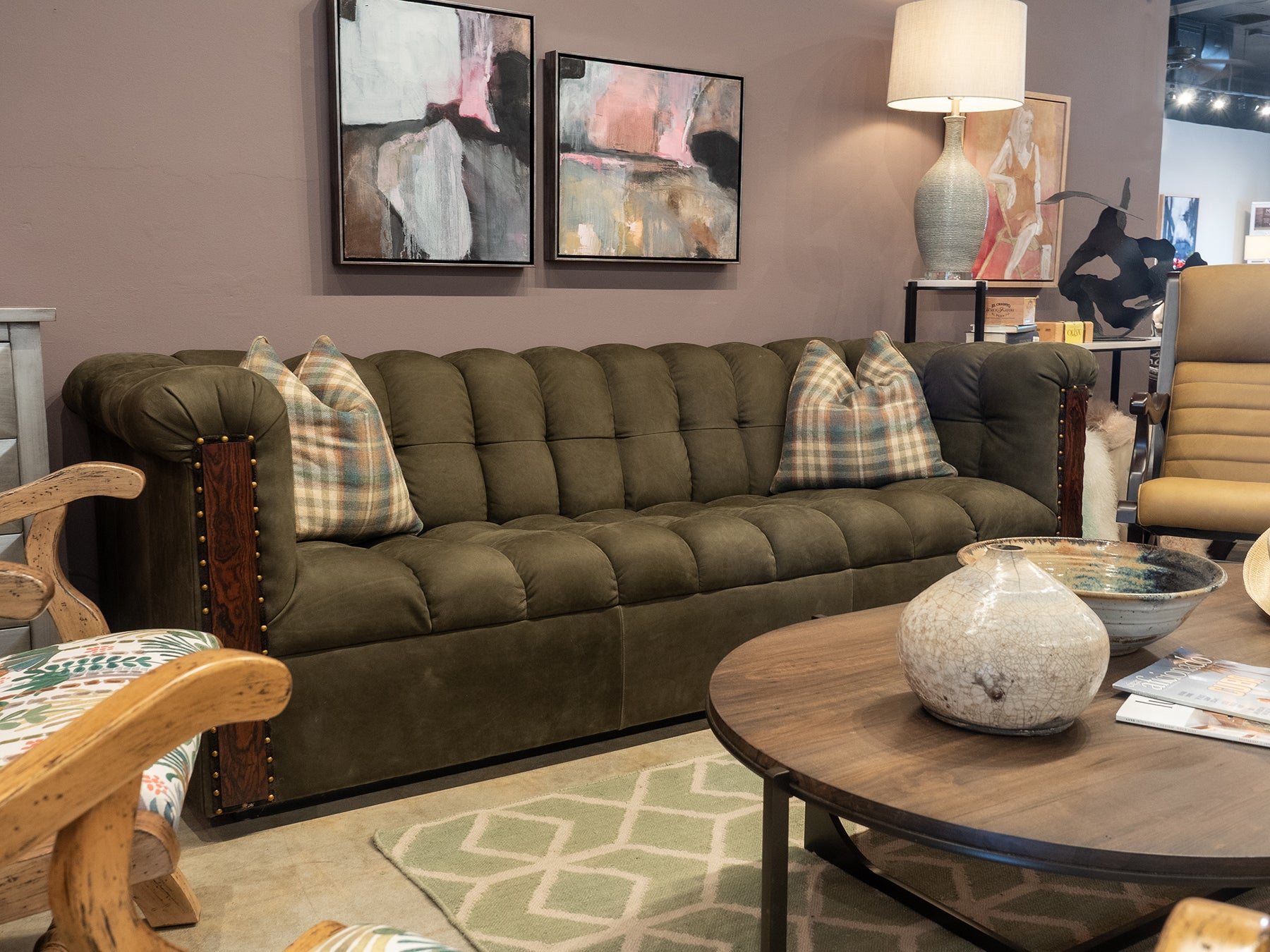Dark green leather Camden sofa with channel cushion seat and wood with nail trim accents