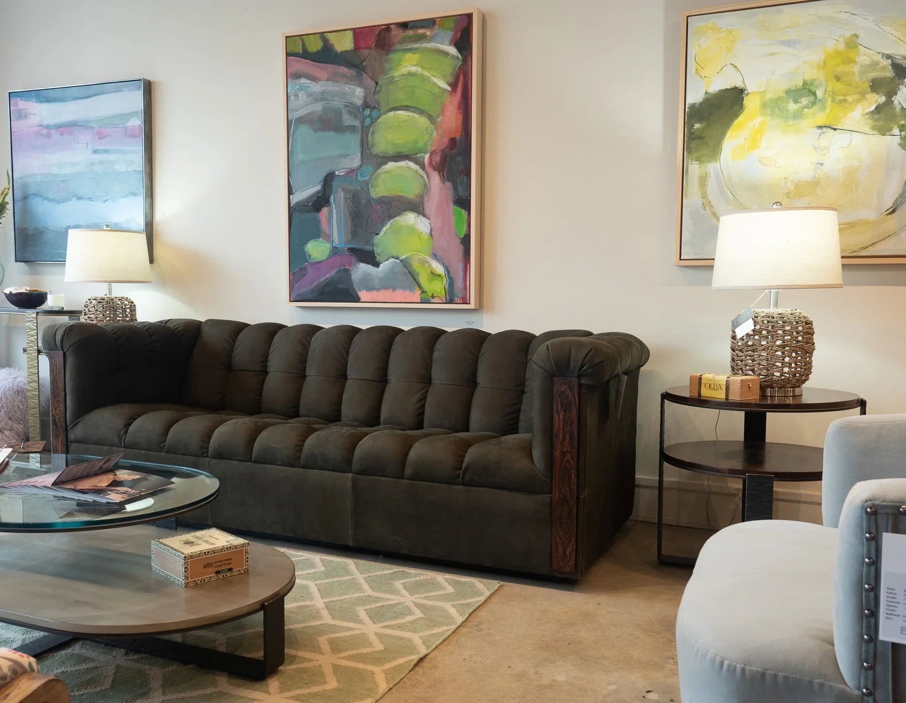Camden dark green leather sofa in showroom