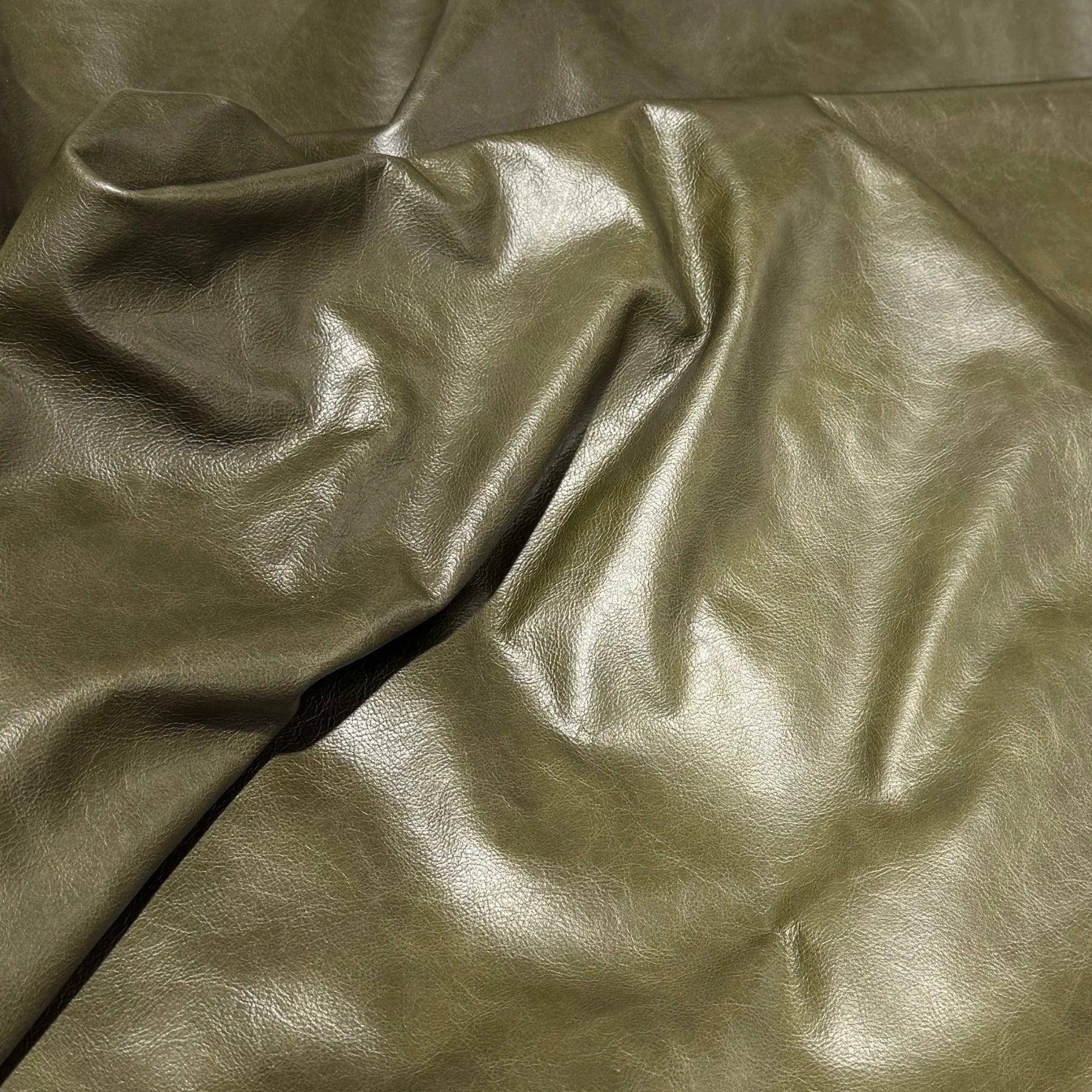 Canyon Evergreen smooth-grain aniline leather hide in a rich evergreen color.