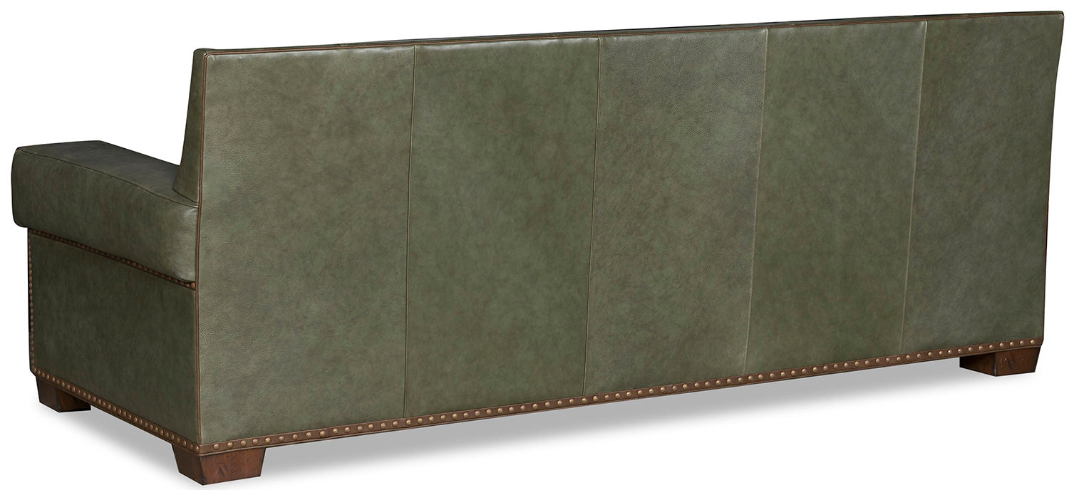 Canyon sage green leather sofa back showing brown gimp and nail trim