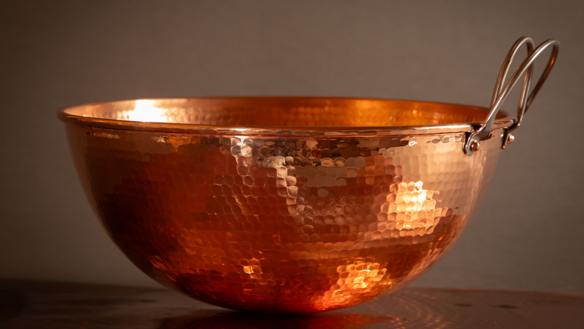 Close up of 12" hammered copper mixing bowl