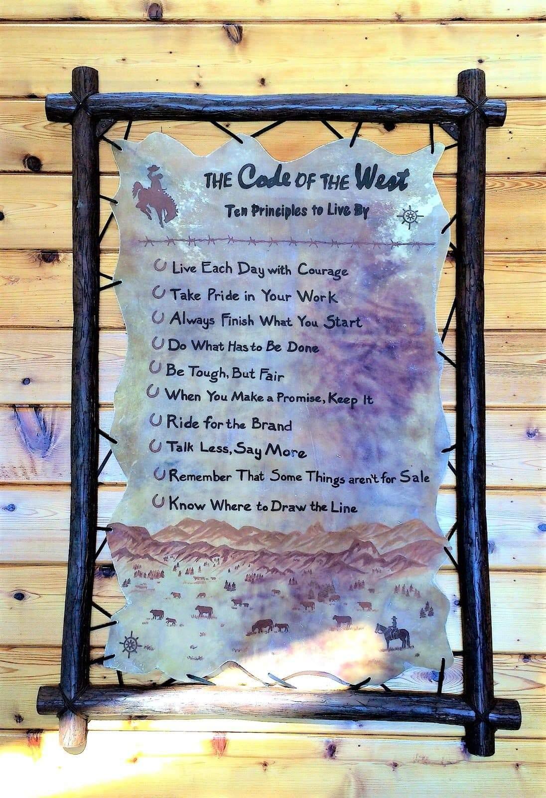 Custom made iron and rawhide "code of the west" rustic handmade wall sign Made in the USA - Your Western Decor