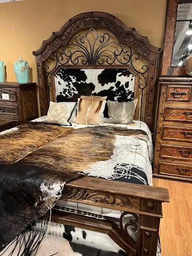 Custom cowhide, carved wood, and Iron bed - Your Western Decor