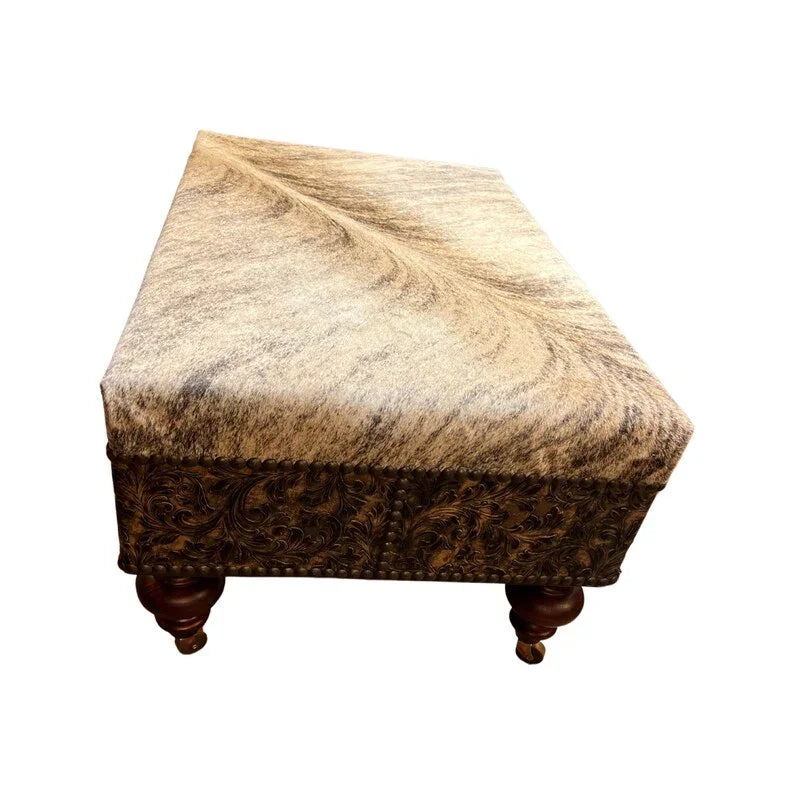 Brindle cowhide top with embossed leather lower, nail head tacking, ottoman