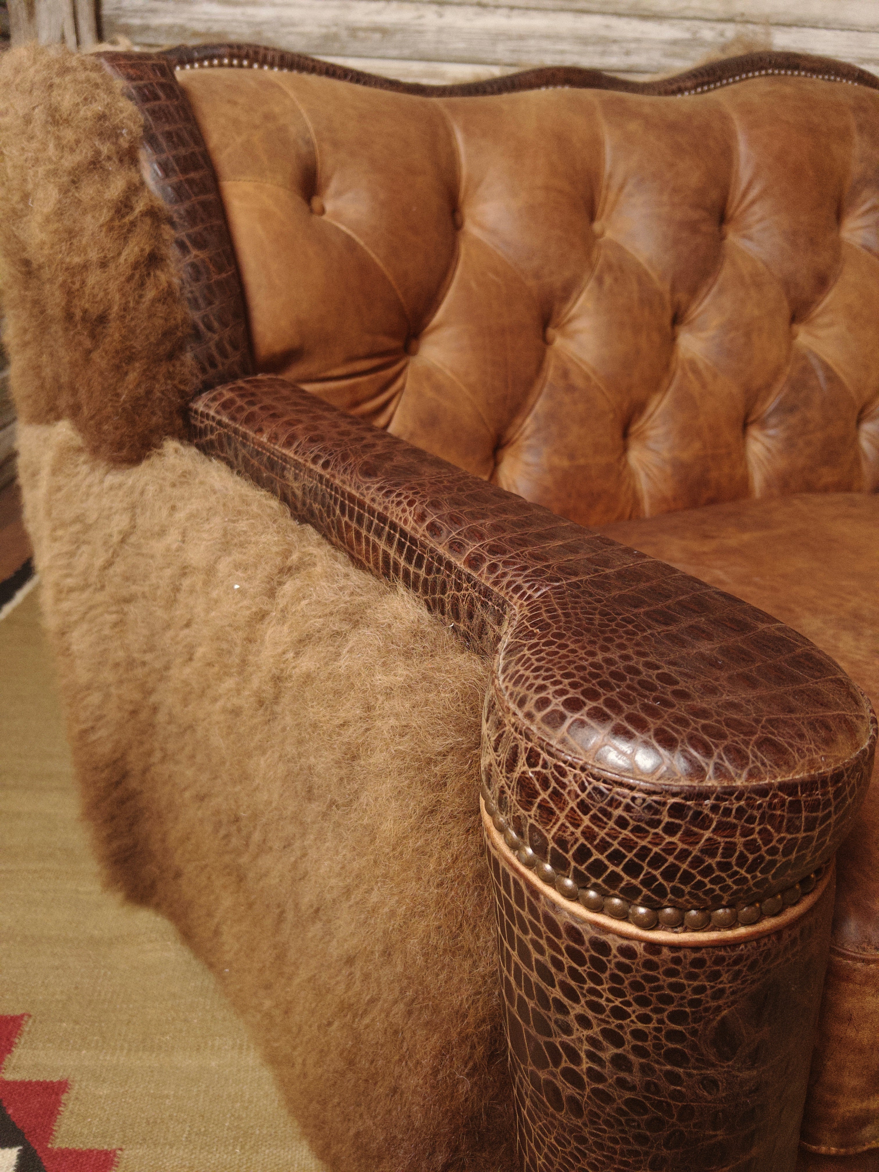 Close up of croc leather upholstered loveseat arm - Your Western Decor