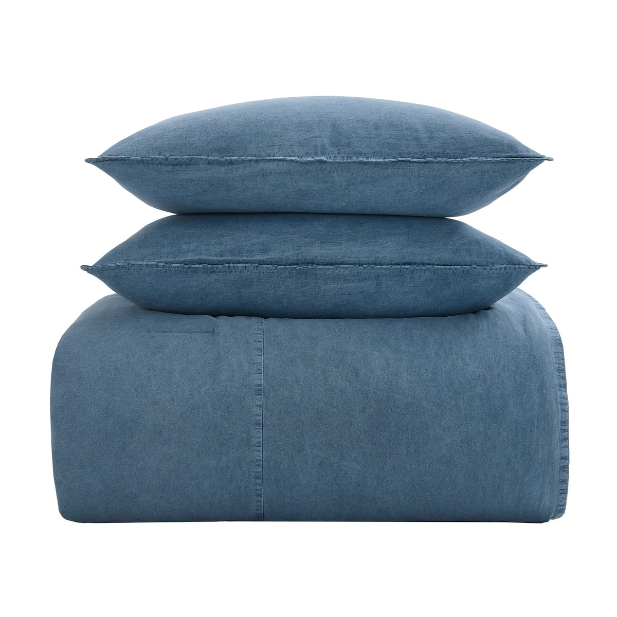 A three-piece bedding set in a dusty blue denim-like fabric, featuring a folded sheet or duvet cover with a stitched seam, two matching square pillows, and one larger rectangular pillow, stacked neatly on a solid white background.
