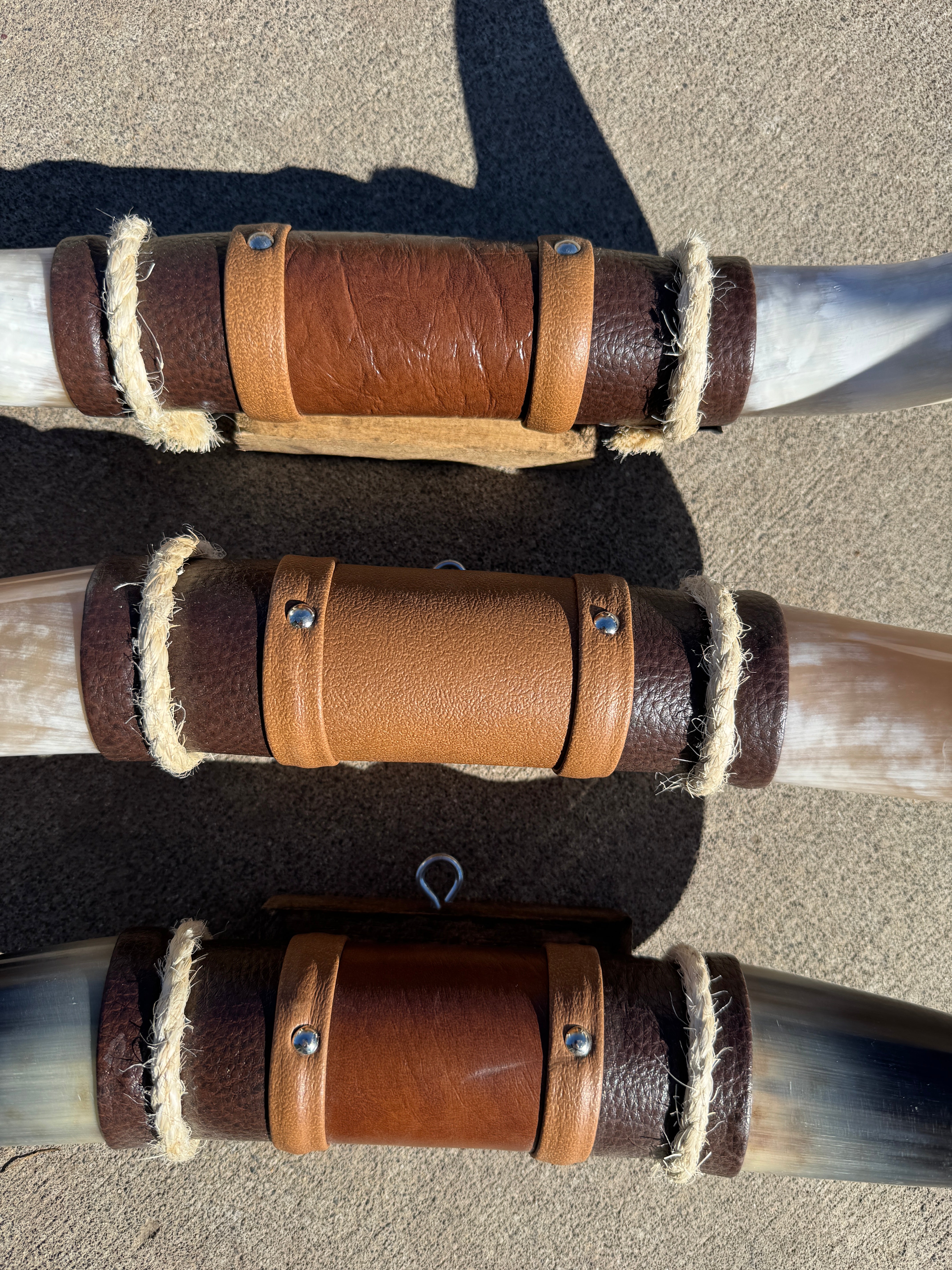 Leather wrapped center of longhorn wall mounts
