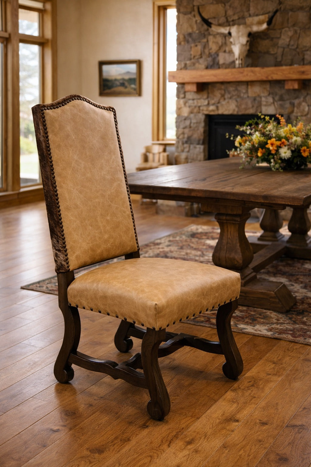Beige leather and brindle cowhide dining chair with rustic wood dining table
