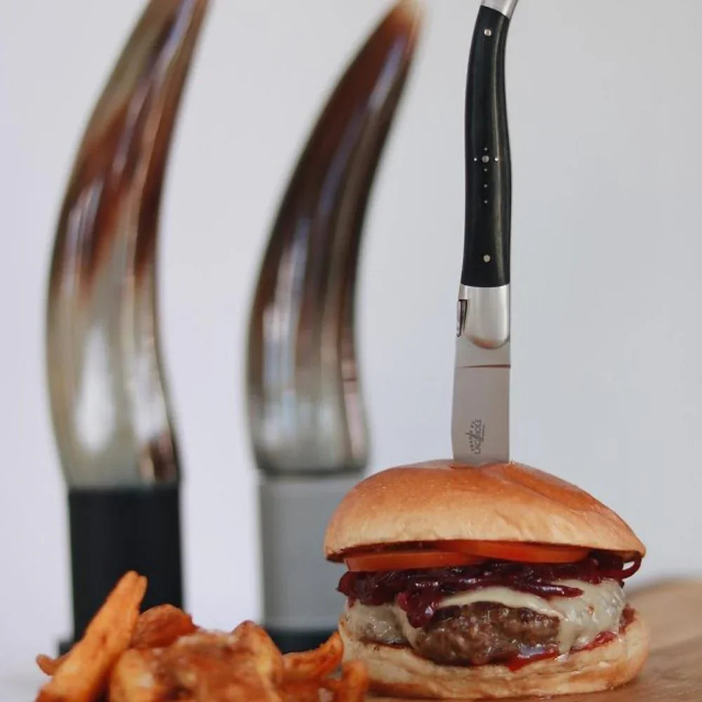 Steak knife in burger with pepper salt grinders - Your Western Decor