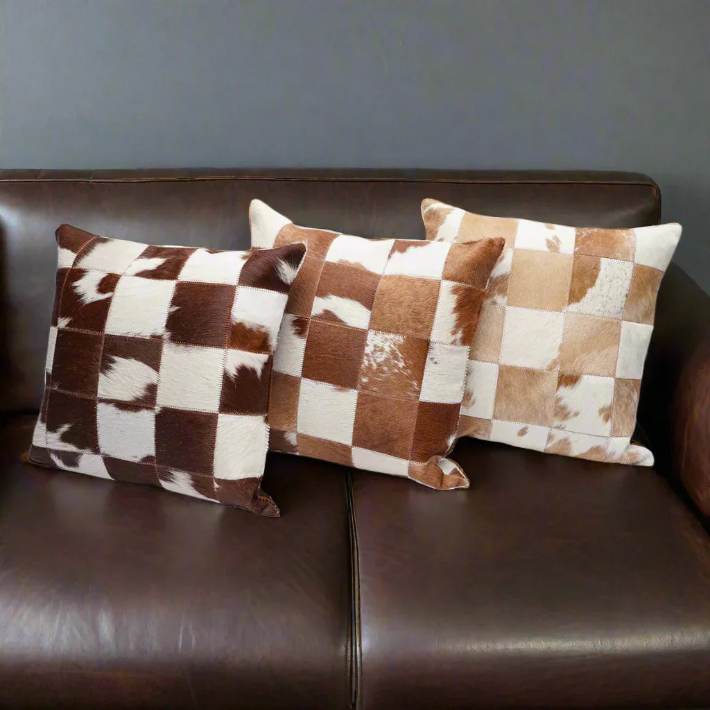 Brown and white cowhide patchwork pillows - Your Western Decor