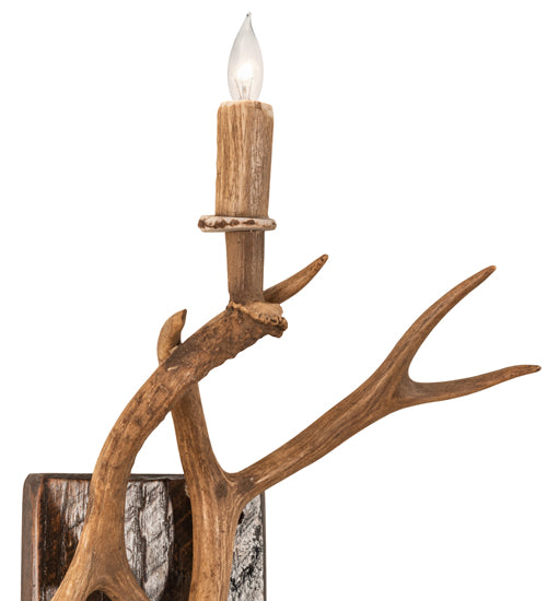 Detail view of elk antler wall sconce