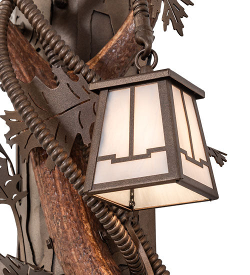 Detail of light shade on elk antler wall sconce