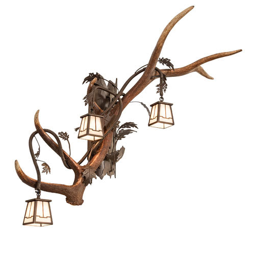Left facing elk and mule deer antler wall sconce with three lantern lights for rustic lodge style, handcrafted in the USA