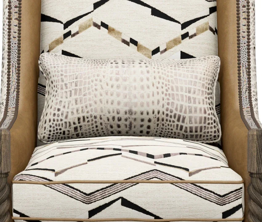 Patterned chair with a pillow featuring geometric designs.