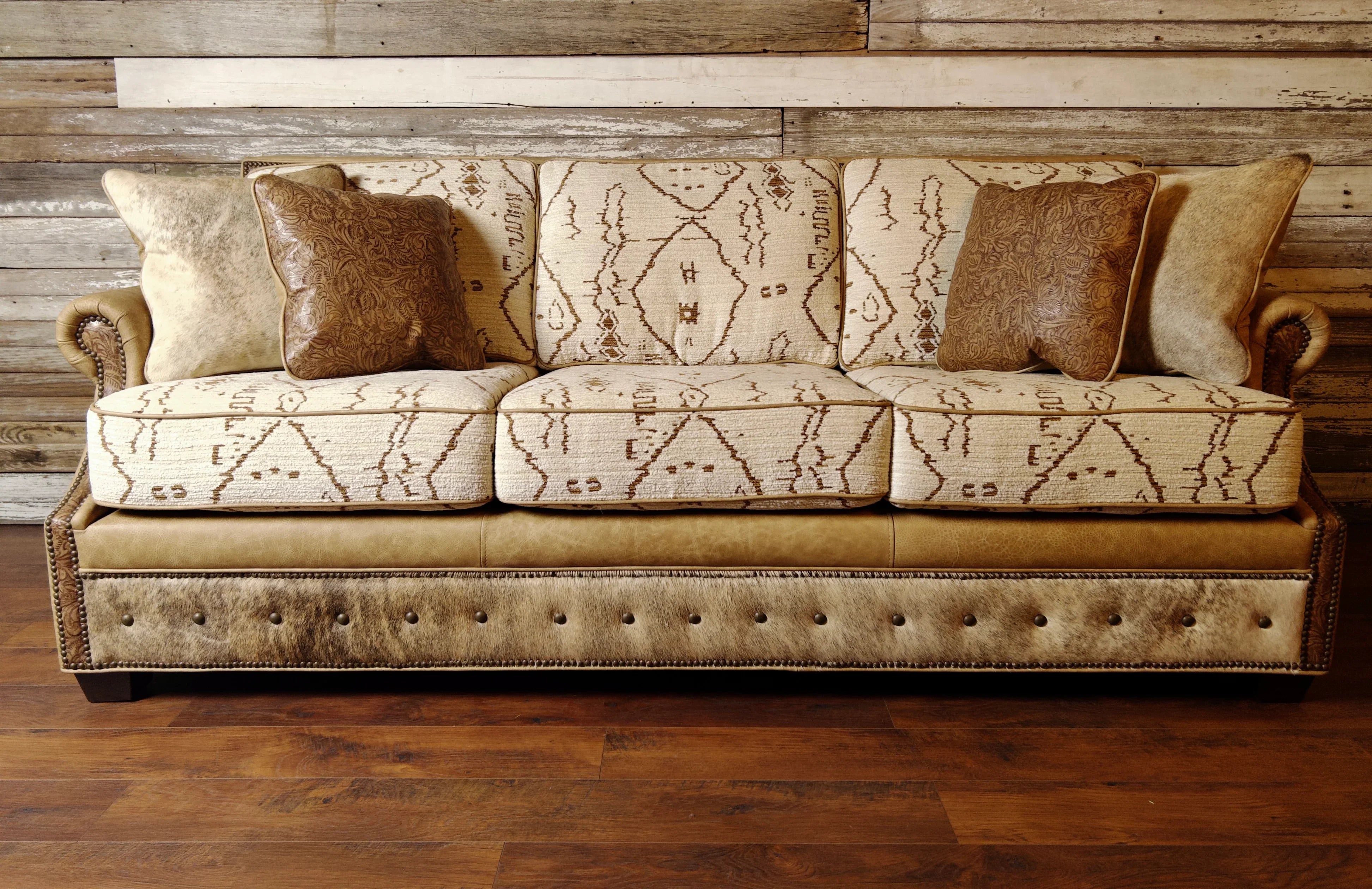 Front view of Mesa Southwestern sofa in fabric, leathers, and cowhide with nail trim