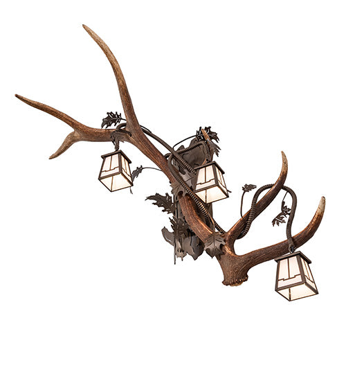Right facing elk and mule deer antler wall sconce with three lantern lights in rustic lodge style, handcrafted in the USA