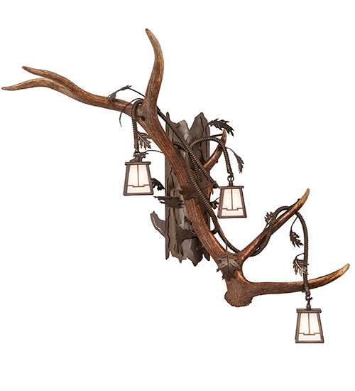 Right facing elk and mule deer antler wall sconce with three lantern lights, handcrafted in the USA