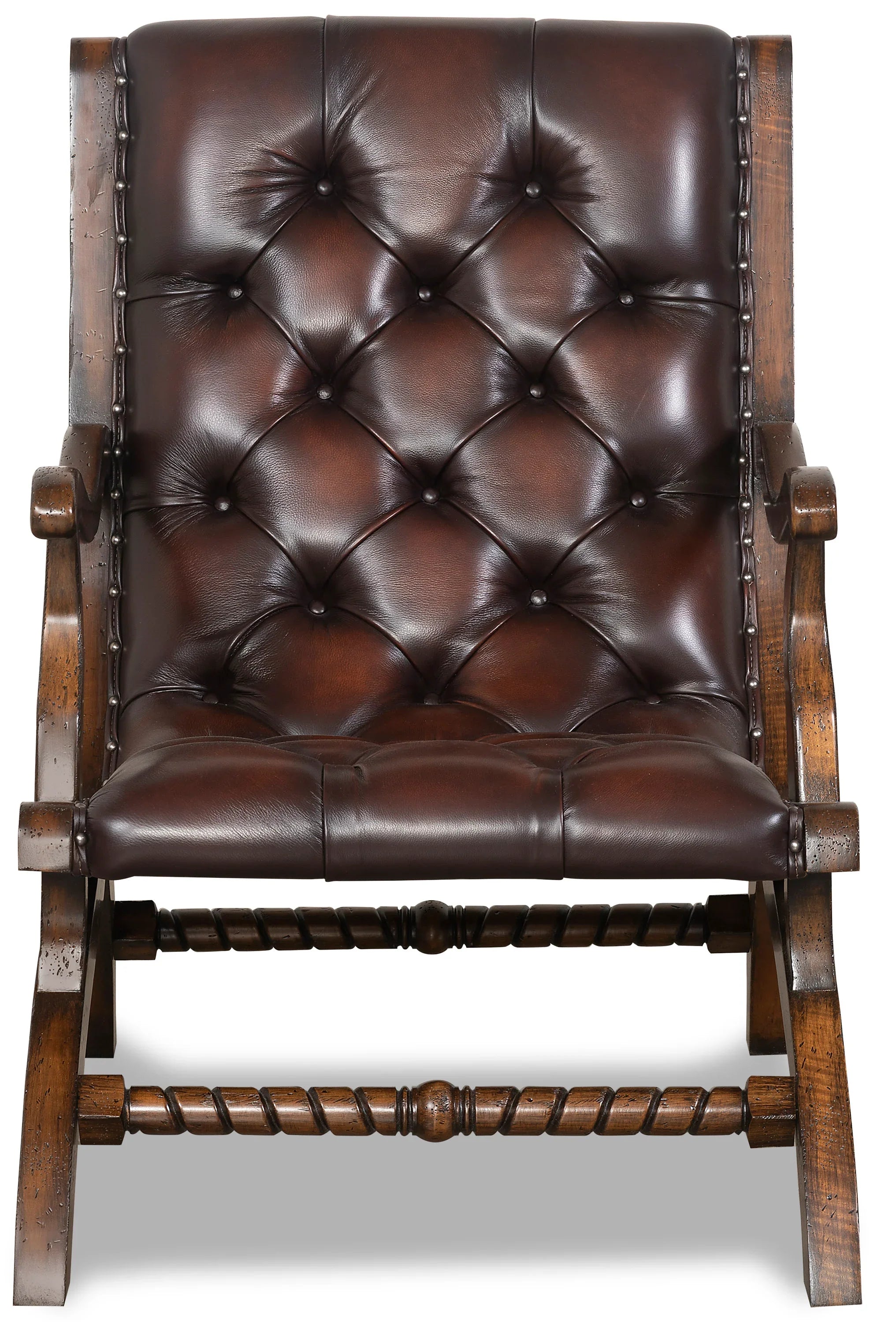 burnished leather tufted reading chair with nailhead trim and wood frame