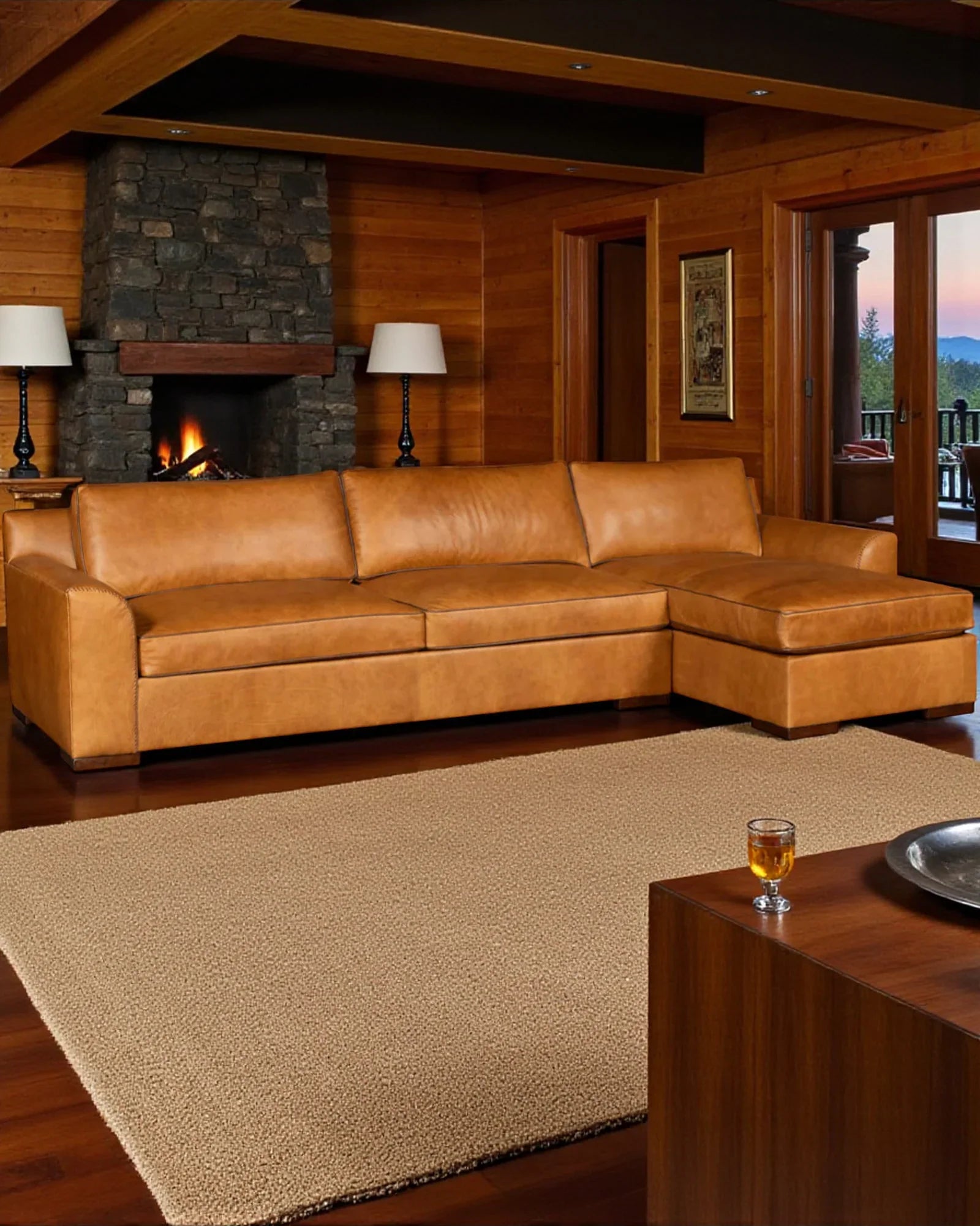 Brown leather sectional sofa in a cozy living room with wooden walls and a fireplace - Your Western Decor