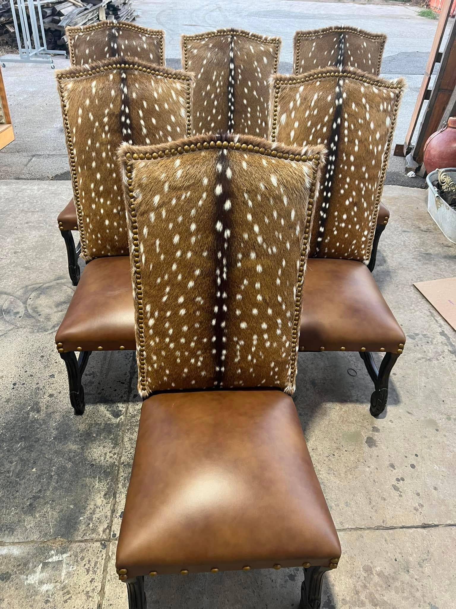 Brown leather chairs with deer skin pattern on a concrete surface - Your Western Decor